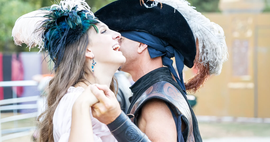 Dancing Couple (in period costume) at the Northern California Renaissance Faire in Casa de Fruta, California.