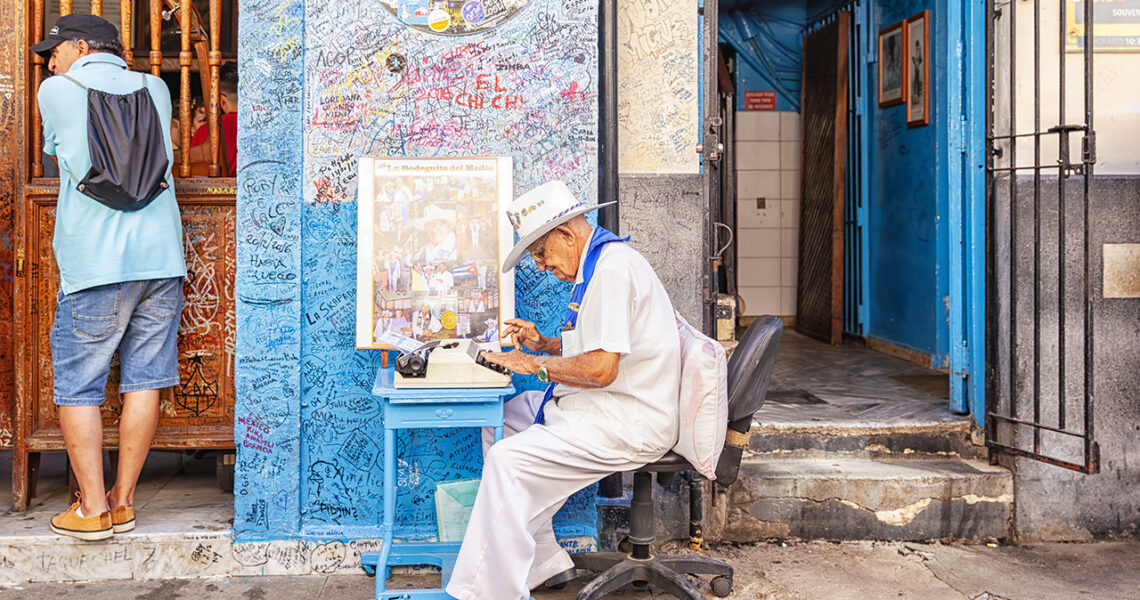 Writer outside La Bodeguita del Medio at Calle Empedrado in Havana, Cuba